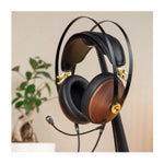 Meze 99 Classics headset for streaming and gaming walnut finish with gold highlights on headphone stand