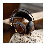 Meze 99 Classics headphones with detachable Kevlar cable in a lifestyle settings