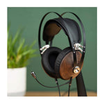 Meze 99 Classics headset for streaming and gaming walnut finish with silver highlights on headphone stand